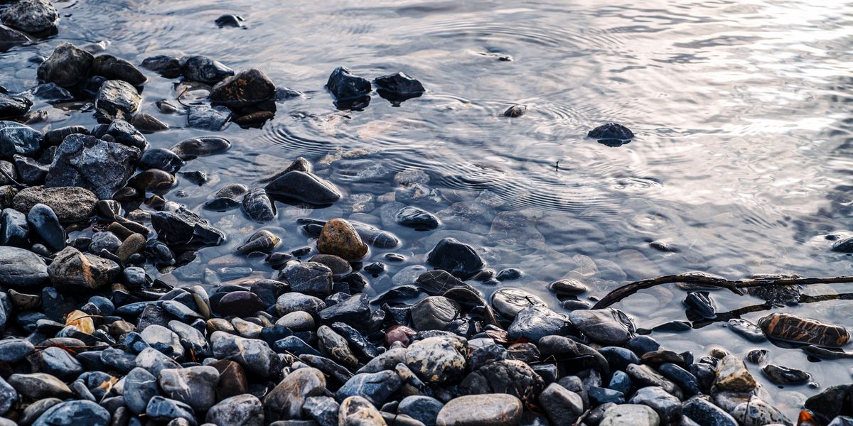 Smooth river stones — stillness and grounding